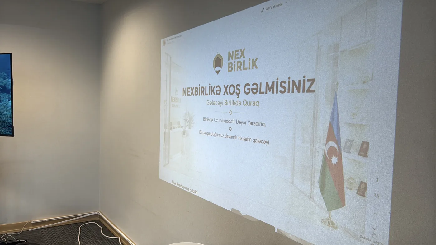Duvarda NexBirlik sunumunun yansıması · müşterinin sağladığı fotoğraf